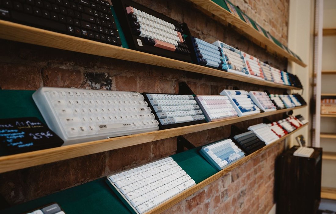 Shelf display of colorful mechanical keyboards showing India market variety
