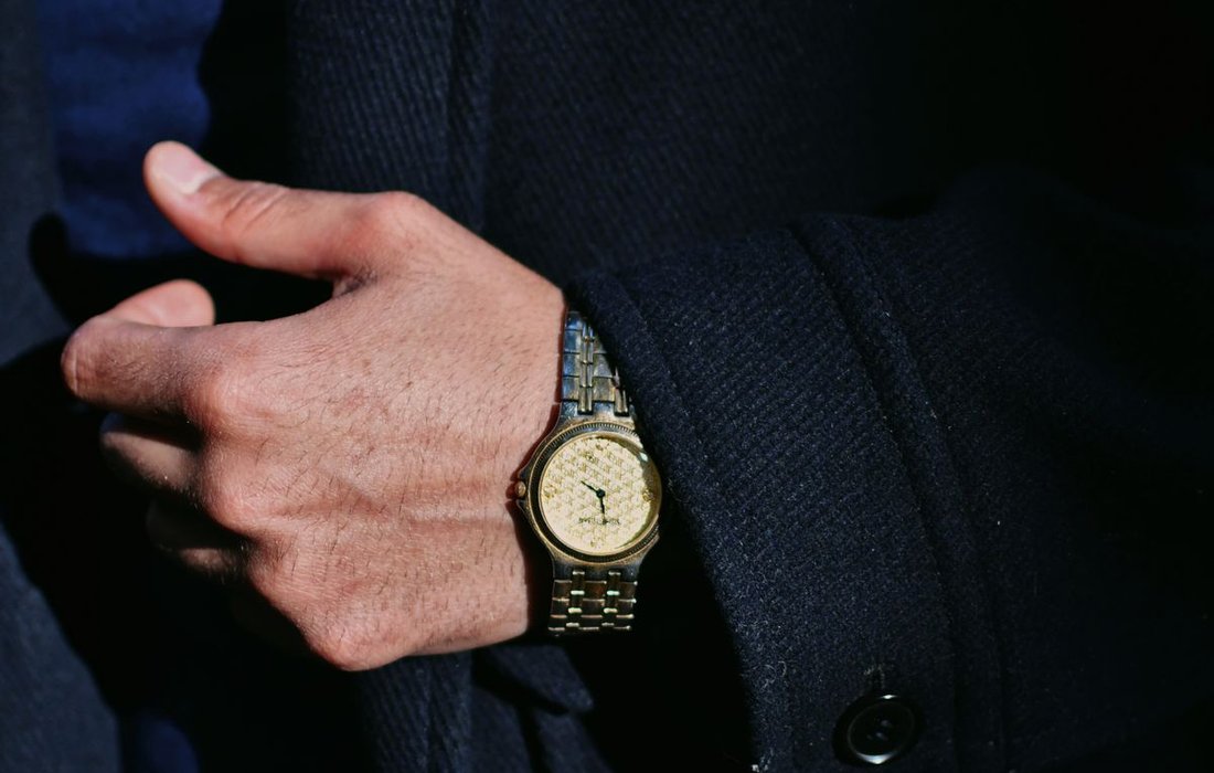 Man wearing an elegant analog wristwatch